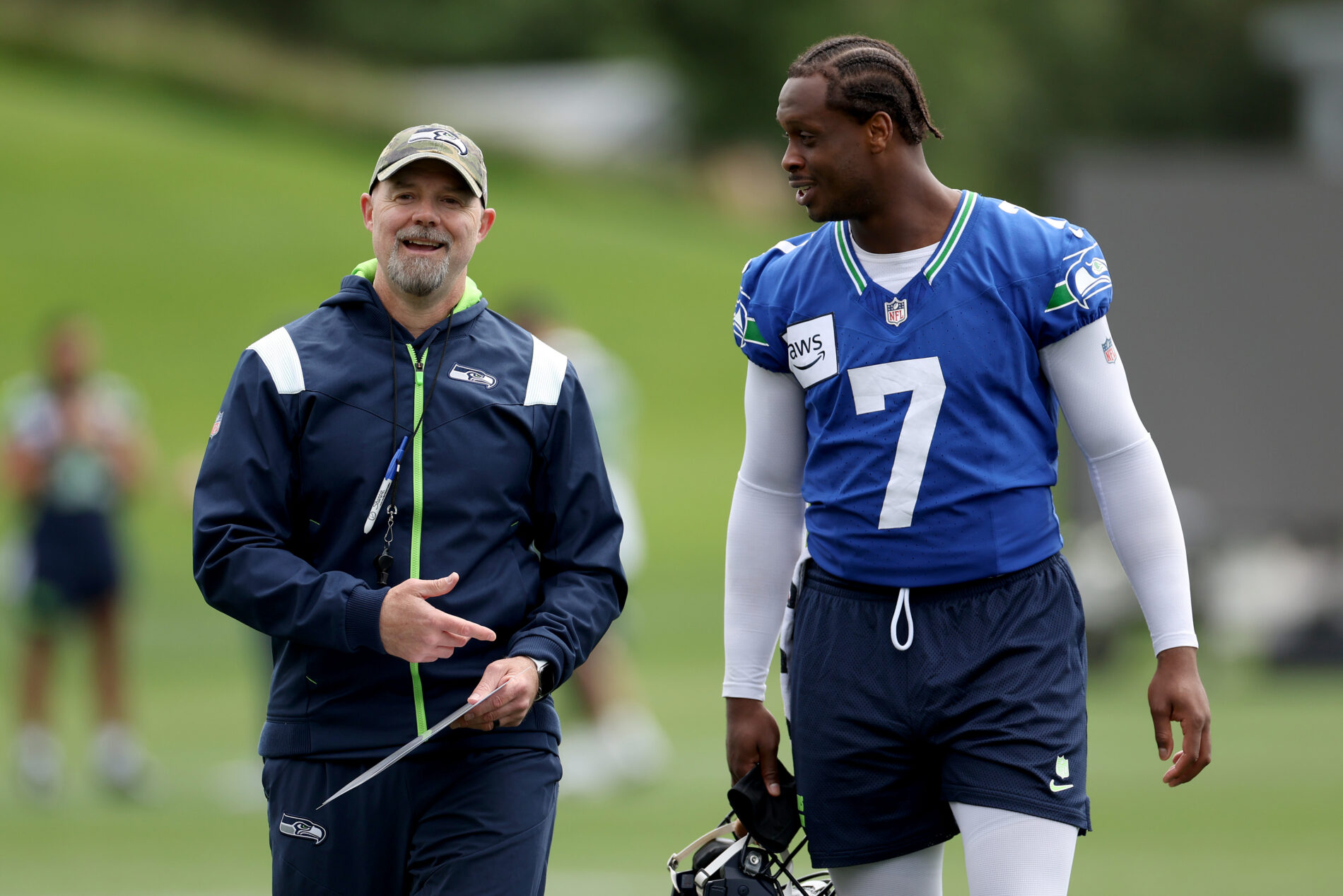 Seahawks Offense Coordinator Ryan Grubb and Quarterback Geno Smith